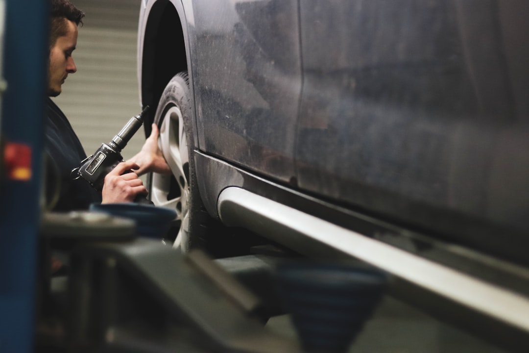 car mechanic inspecting suv
